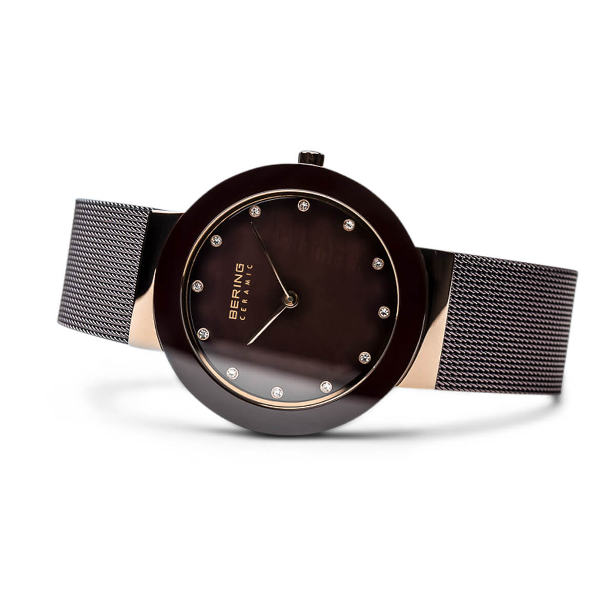 Wristwatch with brown dial and black mesh strap on a white background