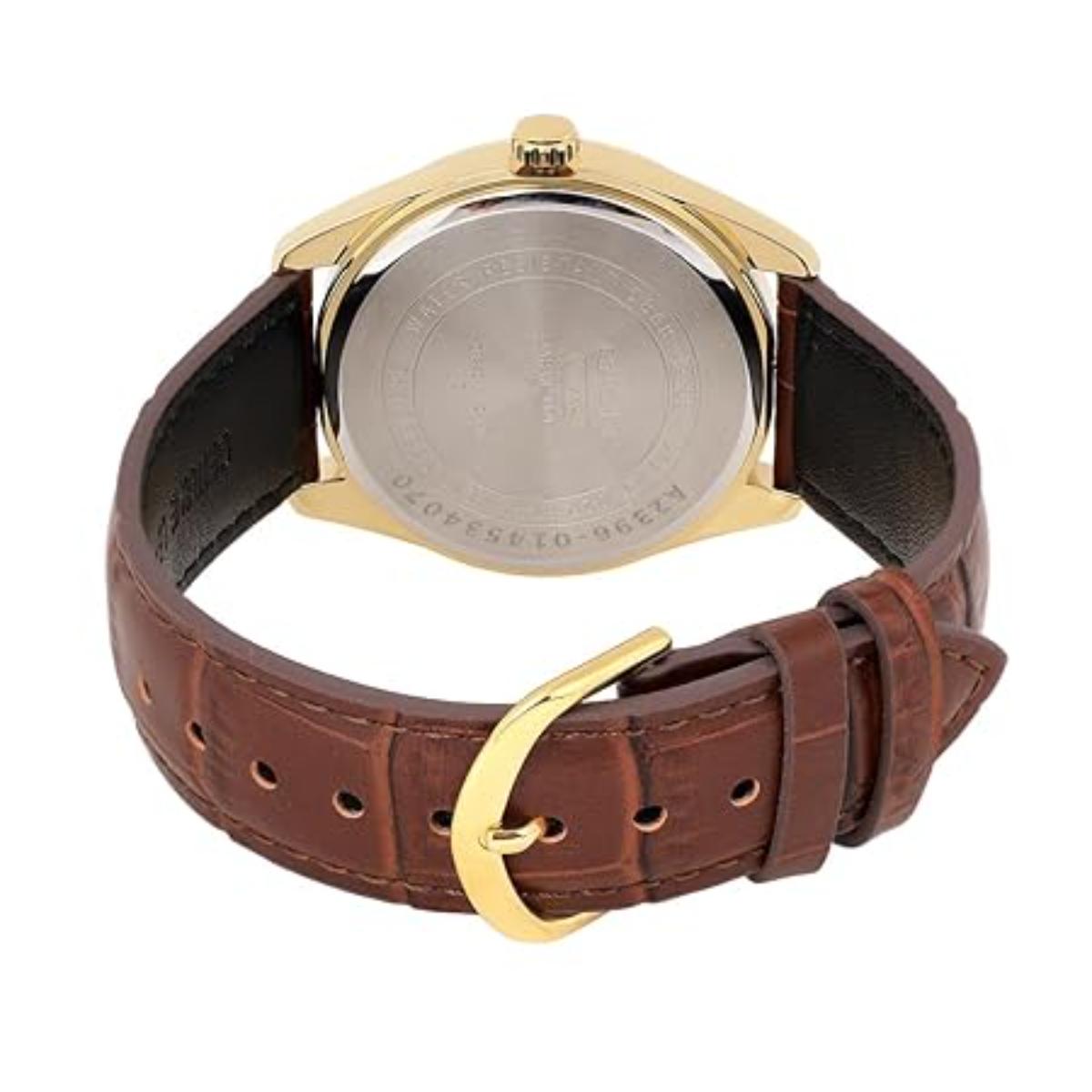Watch with brown leather strap and gold buckle on a white background