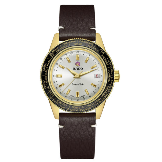 Rado watch with gold case and brown leather strap on a white background