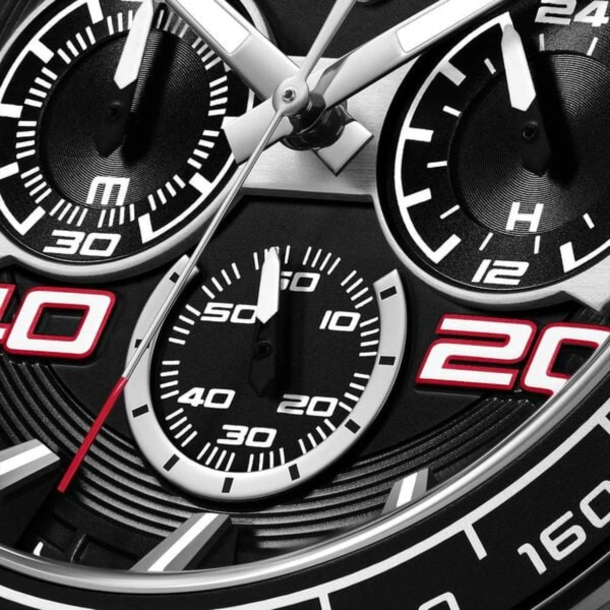 Close-up of a detailed watch face with black and red accents