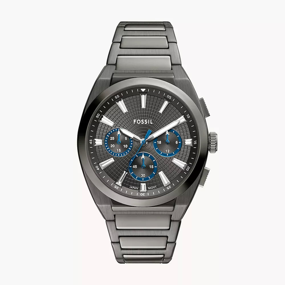 Fossil watch with metallic band and detailed face on a white background