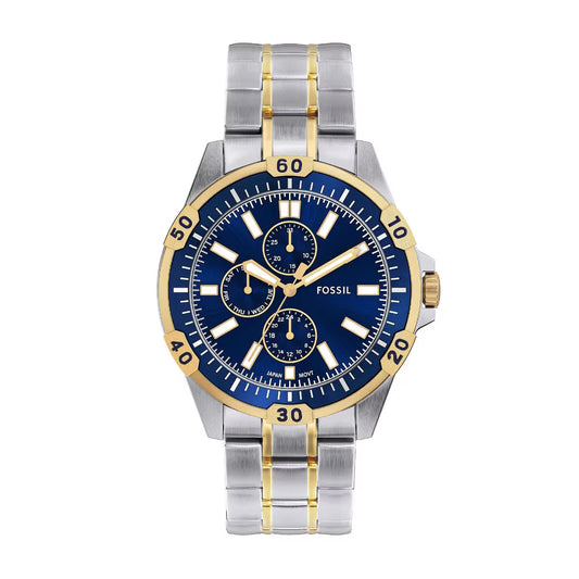 Fossil watch with blue face and silver and gold band on white background