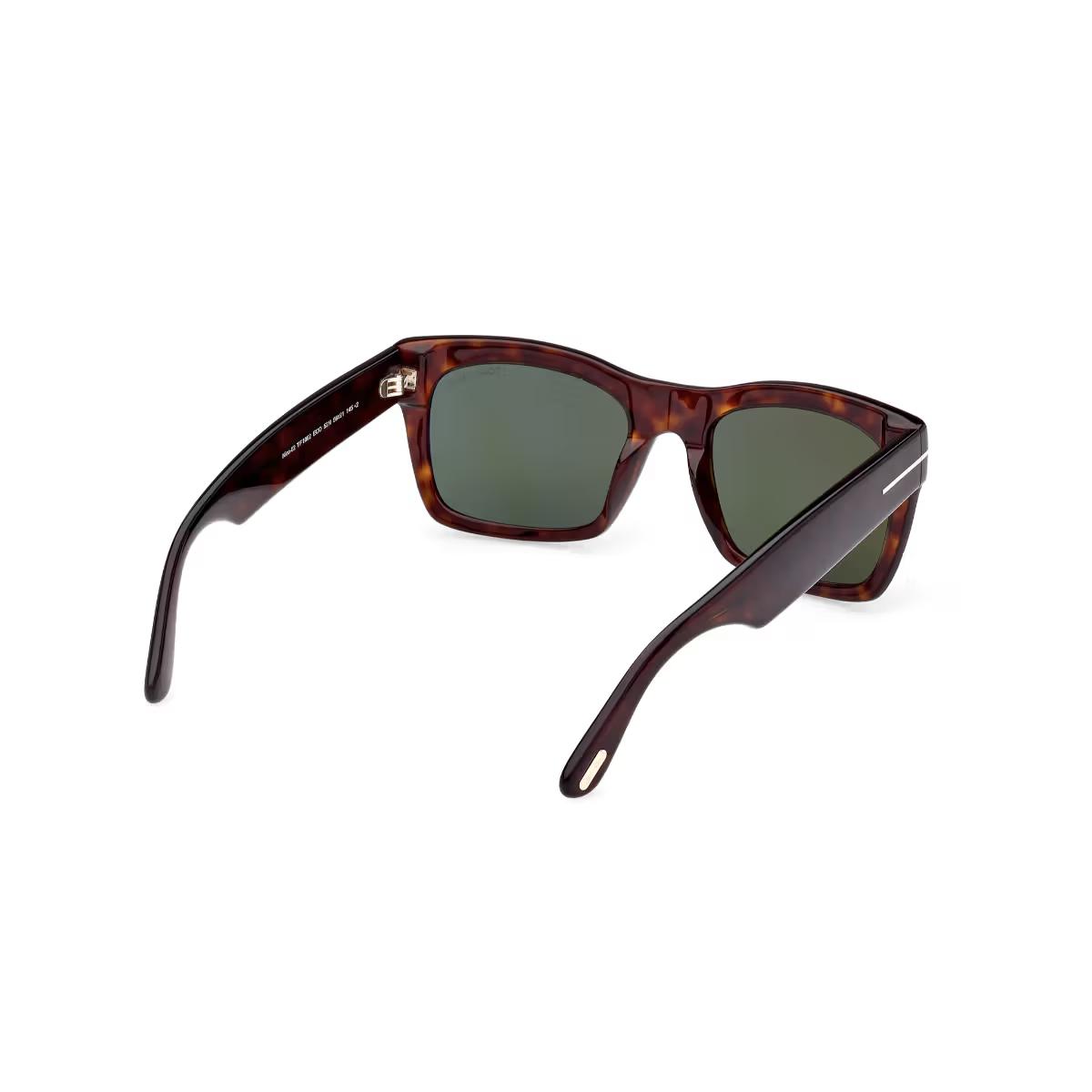 Sunglasses with tortoiseshell frame and dark lenses on a white background