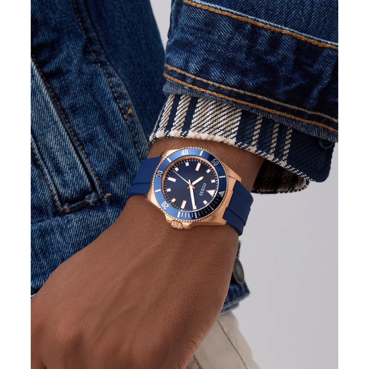 Blue watch on a wrist with denim jacket