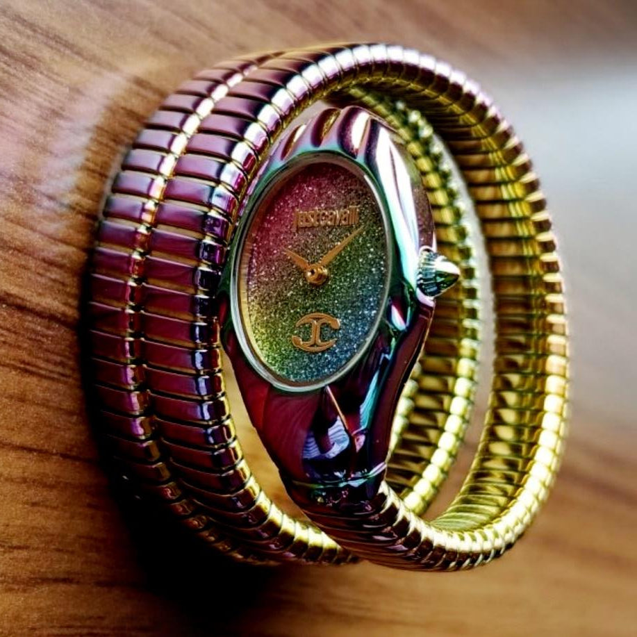 Multicolored bracelet with a shiny clasp on a wooden surface