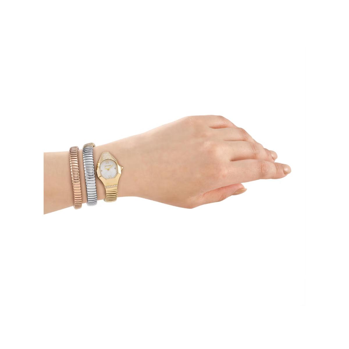 Hand wearing multiple bracelets on a white background
