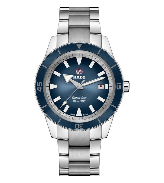 A RADO Captain Cook Automatic Watch for Men featuring a blue dial, stainless steel bracelet, and a date display.