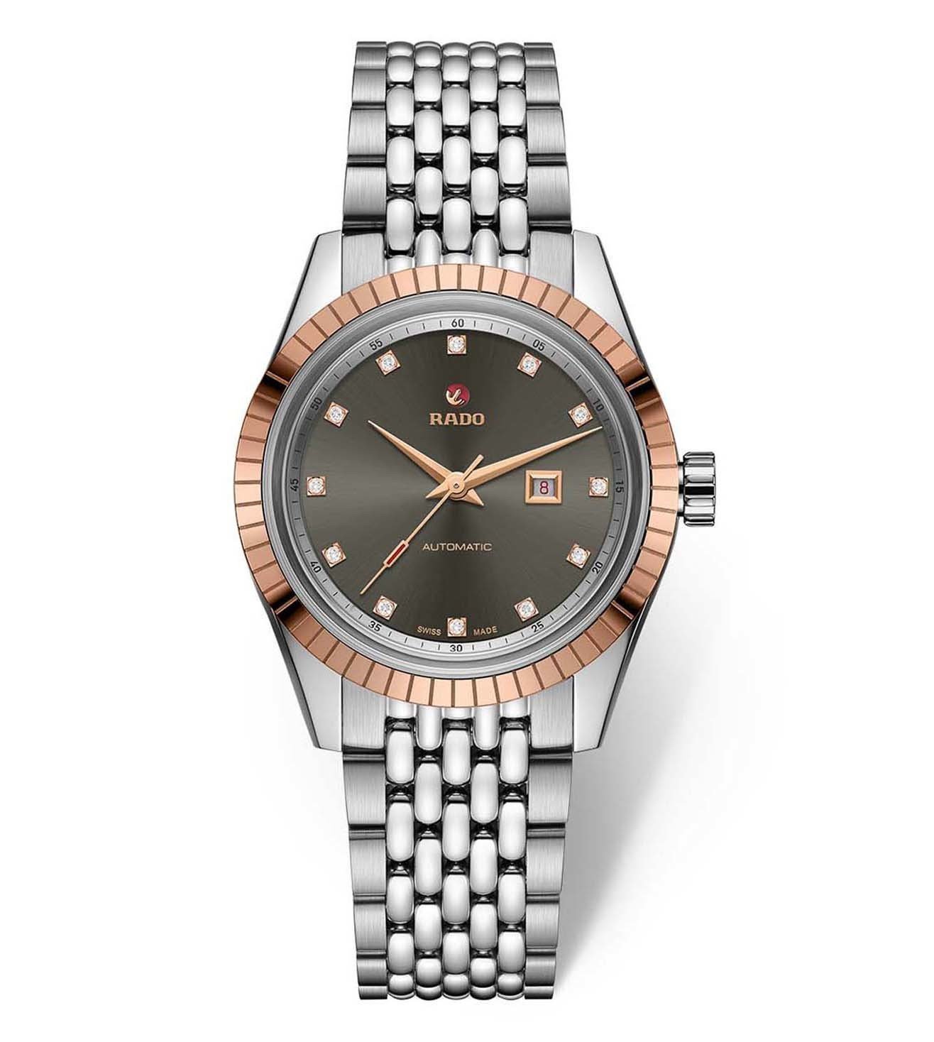 A Rado HyperChrome Classic Automatic Diamonds watch for women, with a rose gold case, silver bracelet, and a green dial.