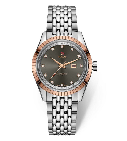 A Rado HyperChrome Classic Automatic Diamonds watch for women, with a rose gold case, silver bracelet, and a green dial.