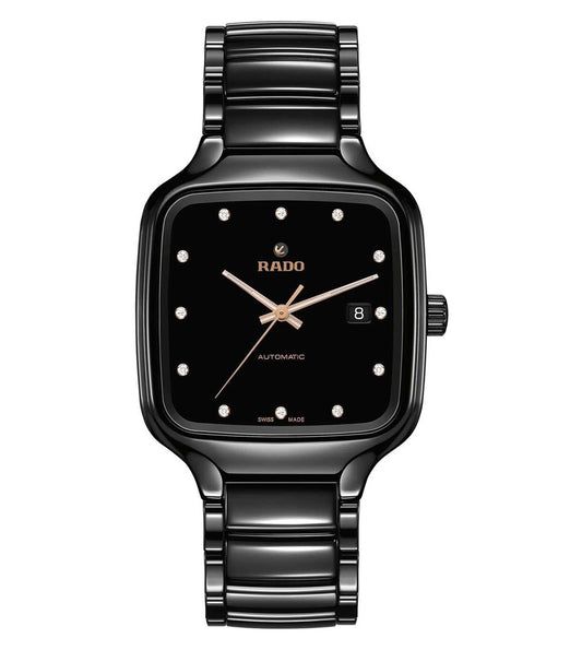 A black Rado True Square Automatic Diamonds watch with a square-shaped face, adorned with multiple diamonds, a black band, and a rose gold accent on the hands.
