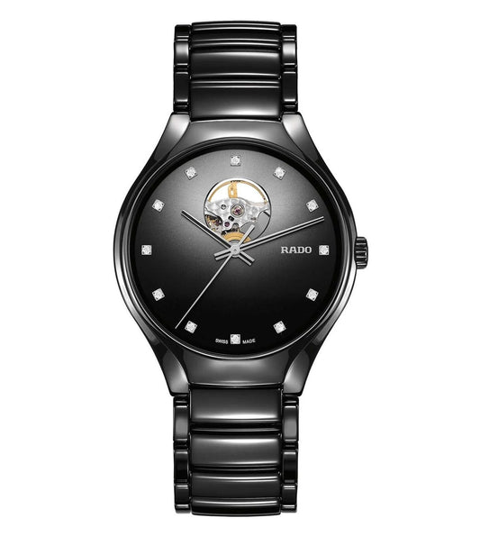 A black Rado True Secret Diamonds unisex watch with a dial opening at 12 o'clock, revealing the automatic movement.