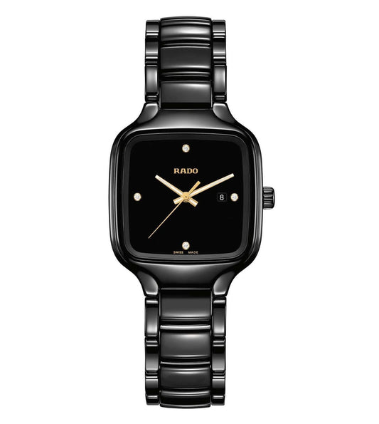 A black Rado True Square Diamonds watch with a square-shaped face and a gold-colored hour hand on a black band.