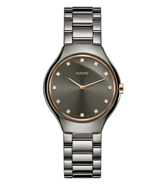 A Rado True Thinline Diamonds watch for women with a black band and dial, featuring diamond accents and a slim profile.