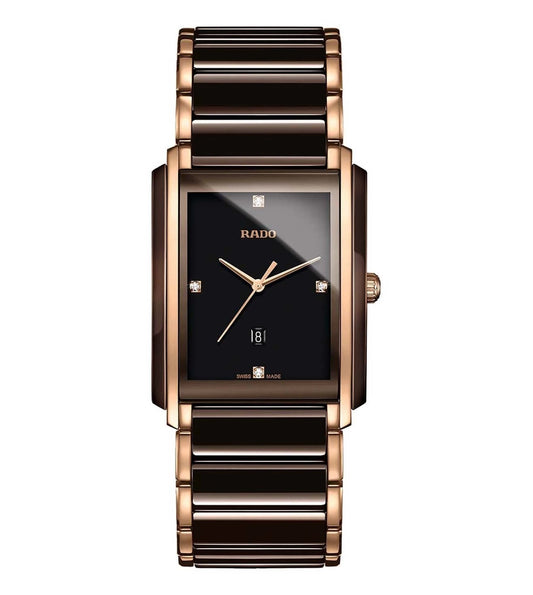 A Rado Integral Diamonds unisex watch with a black dial, rose gold case, and bracelet.