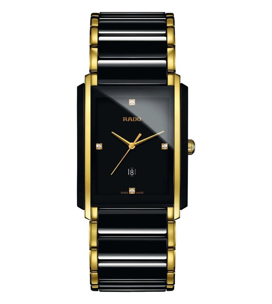 A Rado Integral Diamonds watch with a black dial, gold case, and bracelet featuring diamond accents.