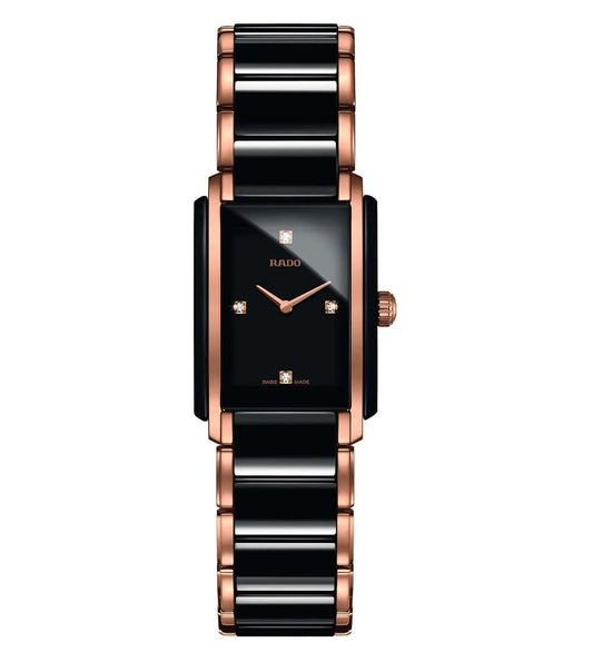 A Rado Integral Diamonds watch for women with a black dial, rose gold case, and bracelet.