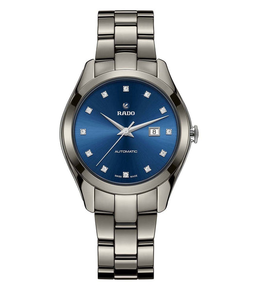 A Rado HyperChrome Automatic watch for women with a blue dial, diamond markers, and a silver metallic bracelet.