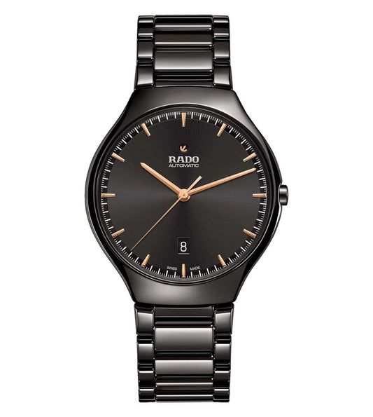 A Rado True Thinline unisex watch with a black ceramic bracelet and a black dial with rose gold hands and markers.