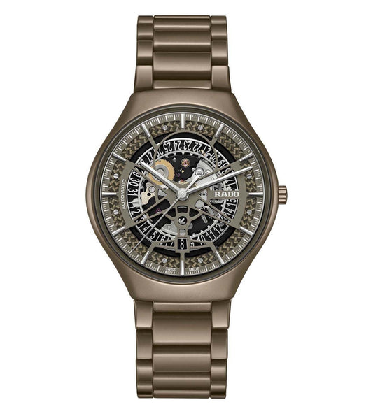 A silver-colored RADO True Thinline unisex watch with a link bracelet and a detailed, analog dial.