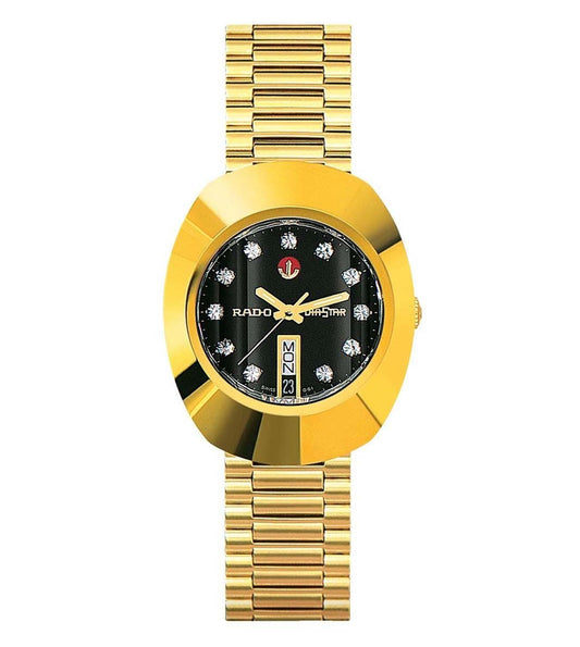 A gold-colored Rado Original watch with a black dial and analog display, featuring a bracelet strap and a prominent logo.
