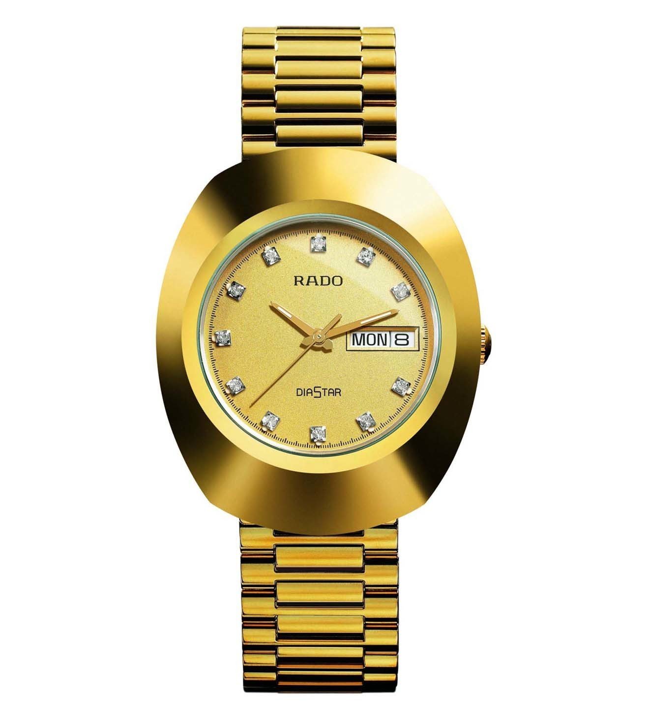 A gold-colored RADO Original watch with a dial featuring diamond-like accents and a day and date display, accompanied by a matching gold bracelet.