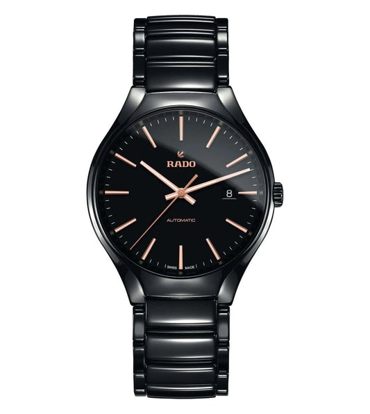 A black Rado True Automatic watch with a stainless steel bracelet and a black dial with rose gold accents.