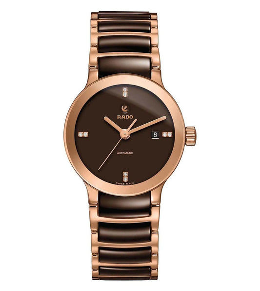 A Rado Centrix Automatic watch for women with a brown dial and rose gold case, accompanied by a leather strap with a patterned texture.
