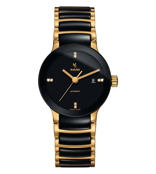 A Rado Centrix Automatic watch for women with a black dial, gold case, and gold bracelet.