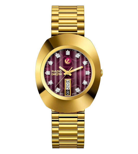 A gold-colored Rado Original watch for men with a dial featuring purple and gold colors and diamond markers.