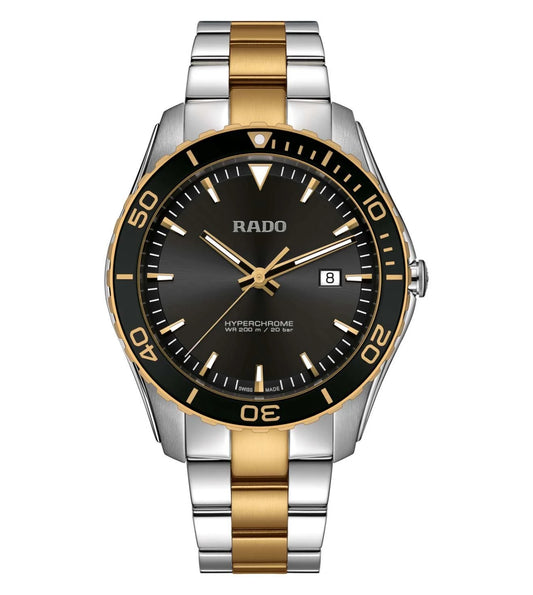 A RADO HyperChrome men's watch with a black dial, gold bezel, and a two-tone gold and silver bracelet.
