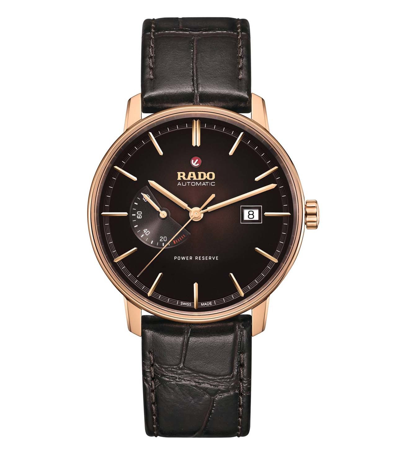 A Rado Coupole Classic Unisex Watch with a brown leather band and rose gold case, featuring a black dial and sapphire crystal.