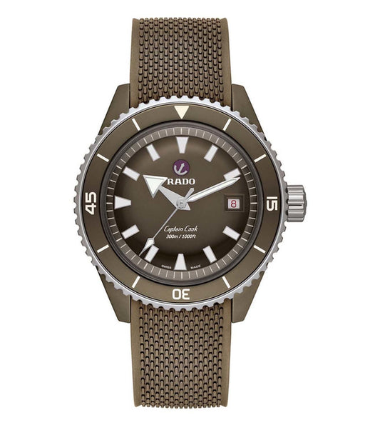 A Rado Captain Cook analog watch with a matte olive-green dial and a matching olive-green rubber strap, featuring a rotating bezel and a date display.