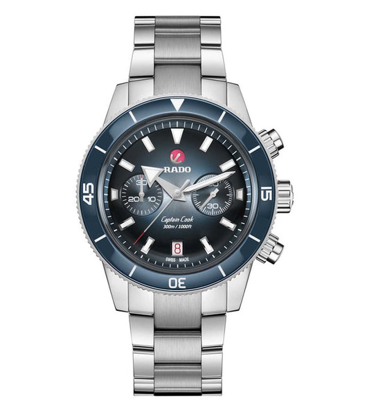 A Rado Captain Cook Chronograph Watch for Men with a blue dial, silver-colored casing, and a stainless steel bracelet.