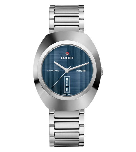 A Rado DiaStar Original Automatic Unisex Watch with a blue brushed dial, rhodium colored hands, a day date display, and a stainless steel bracelet.