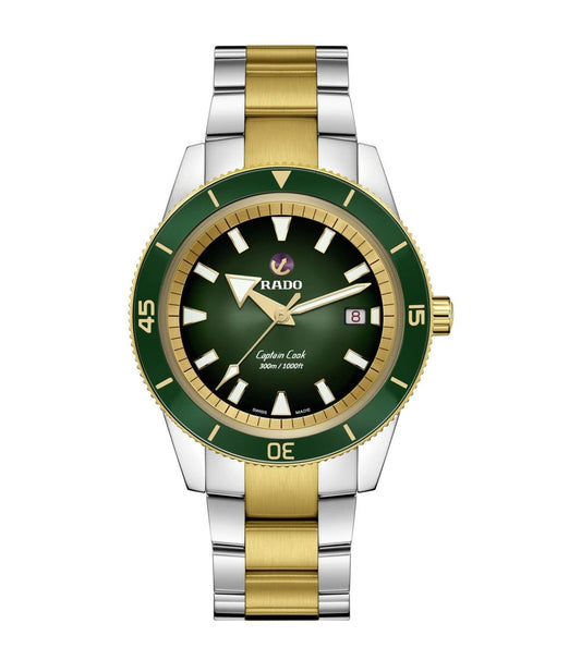 A Rado Captain Cook Automatic watch with a green-to-black gradient dial, rose-goldicolored hands and indexes, and a stainless-steel bracelet with yellow-gold-coloured middle links.