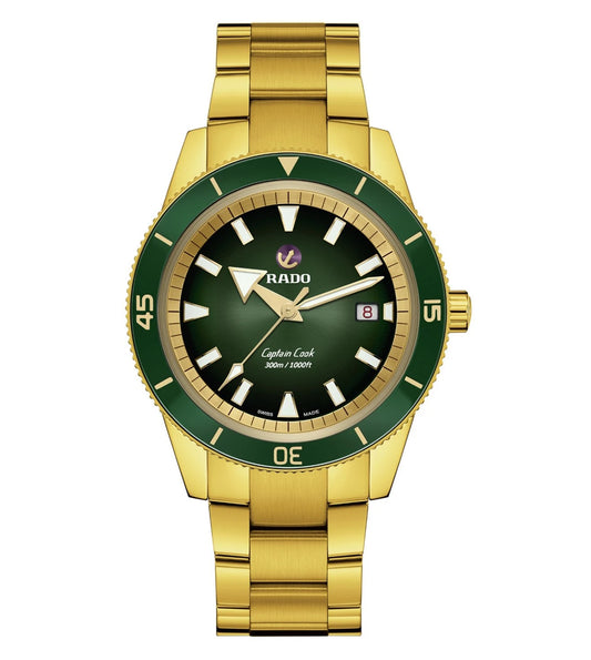 A Rado Captain Cook Automatic watch with a polished yellow gold case and a green dial, featuring a green high-tech ceramic bezel insert and yellow gold coloured metallised numbers.