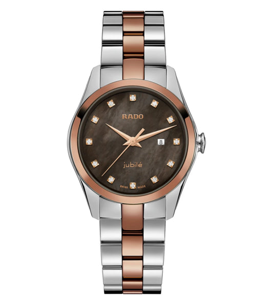 A Rado Hyperchrome analog watch for women with a rose gold colored bezel, a dark brown mother-of-pearl dial, and a two-tone stainless steel bracelet.