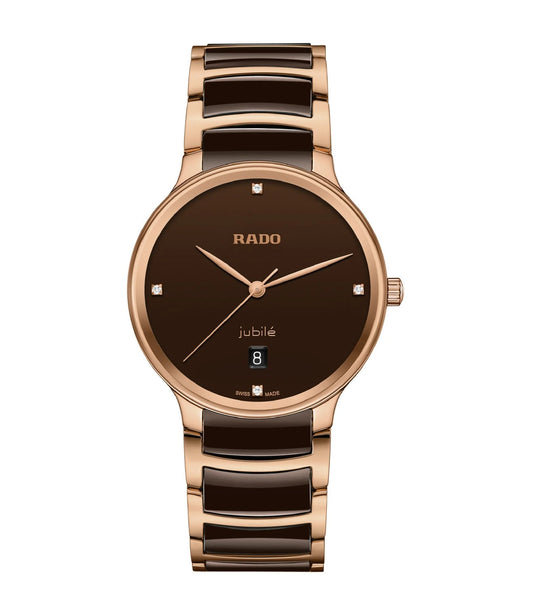 A RADO Centrix Diamonds unisex watch with a rose gold-colored bracelet and dial, featuring a brown lacquered dial with four diamonds and the 'jubilé' logo, rose gold-colored hands, and a curved sapphire crystal.