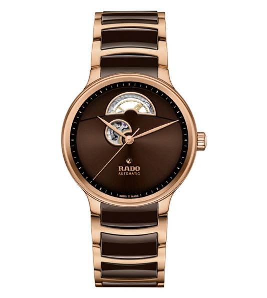 A Rado Centrix Automatic Open Heart Unisex Watch with a rose gold case and brown gradient dial, featuring rose gold hands and a sapphire crystal back.