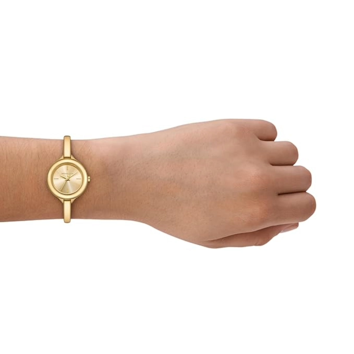 Gold wristwatch on a wrist with a plain white background