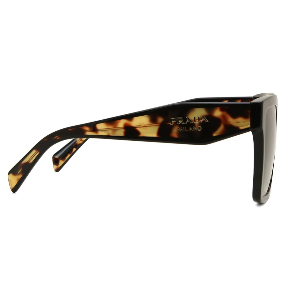 Sunglasses with tortoiseshell frame and Prada logo on a white background