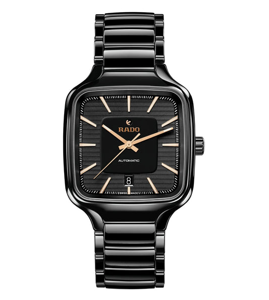 A black Rado True Square automatic unisex watch with a polished ceramic case, rose gold colored hands and indexes, and a flat sapphire crystal.