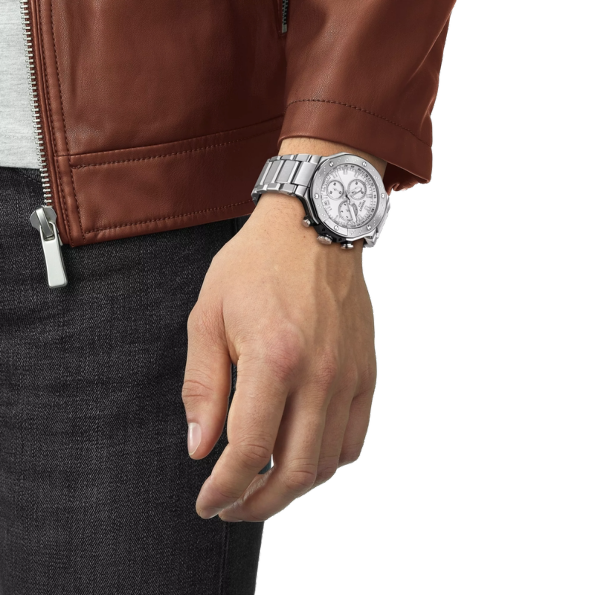 Hand wearing a silver watch with a brown leather jacket on a white background