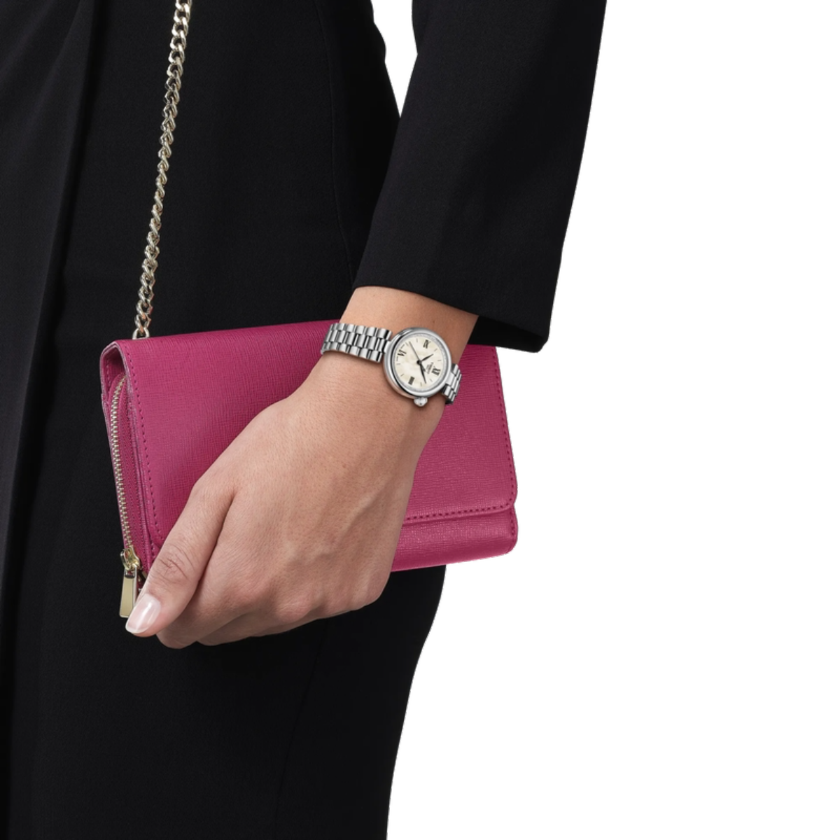 Hand holding a pink clutch with a watch on a white background