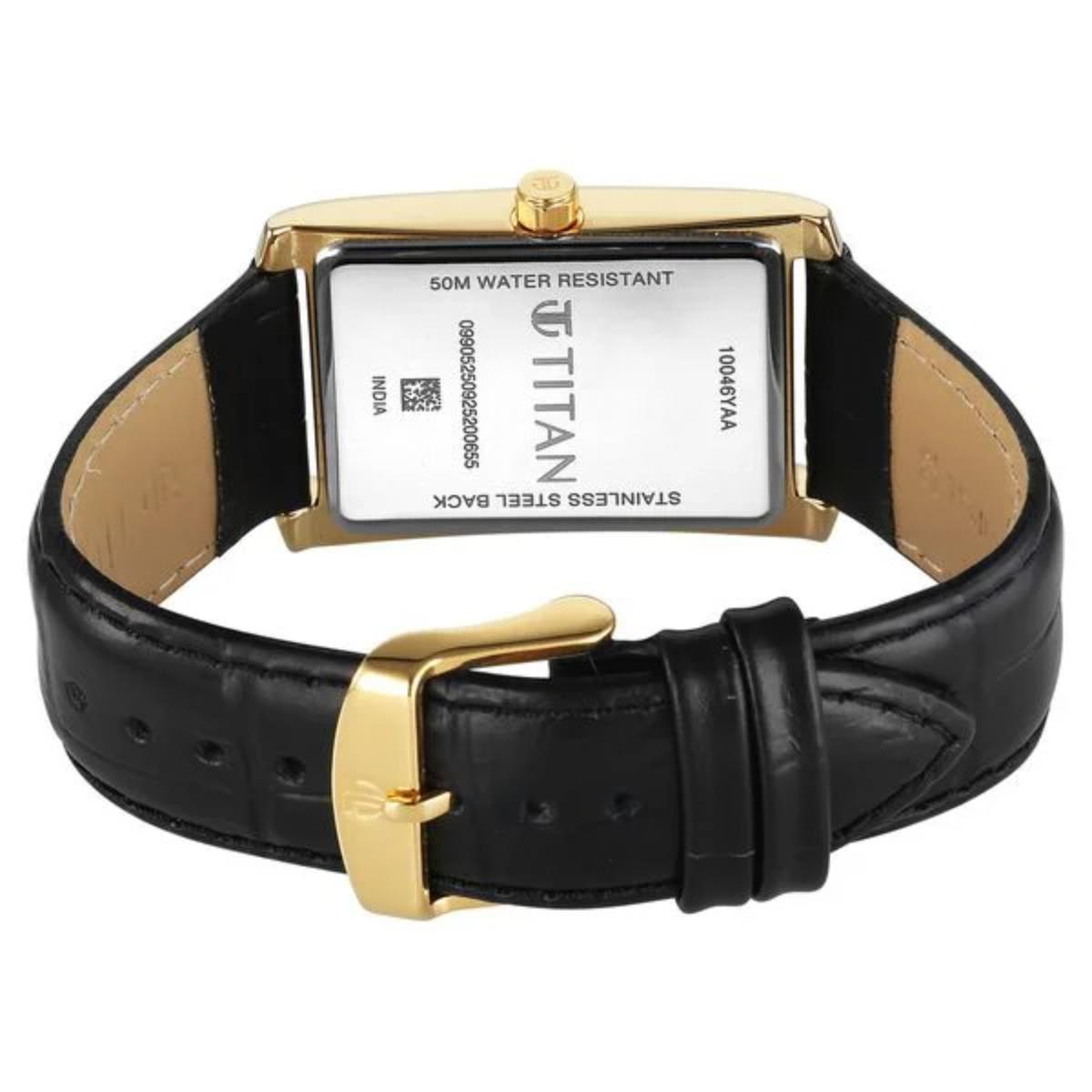 Titan watch with black leather strap and gold buckle on a white background