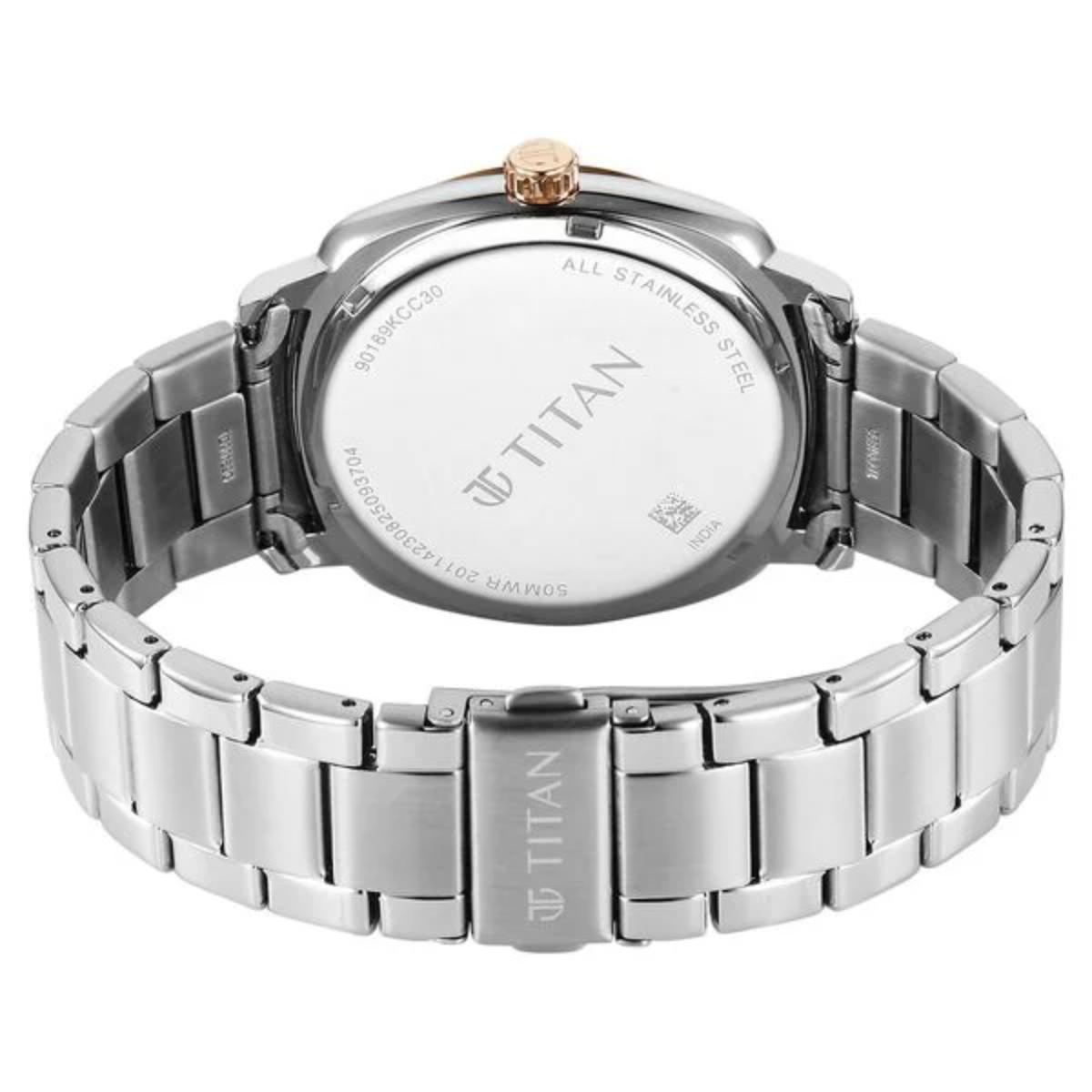 Titan watch with silver metal band and white dial on a white background