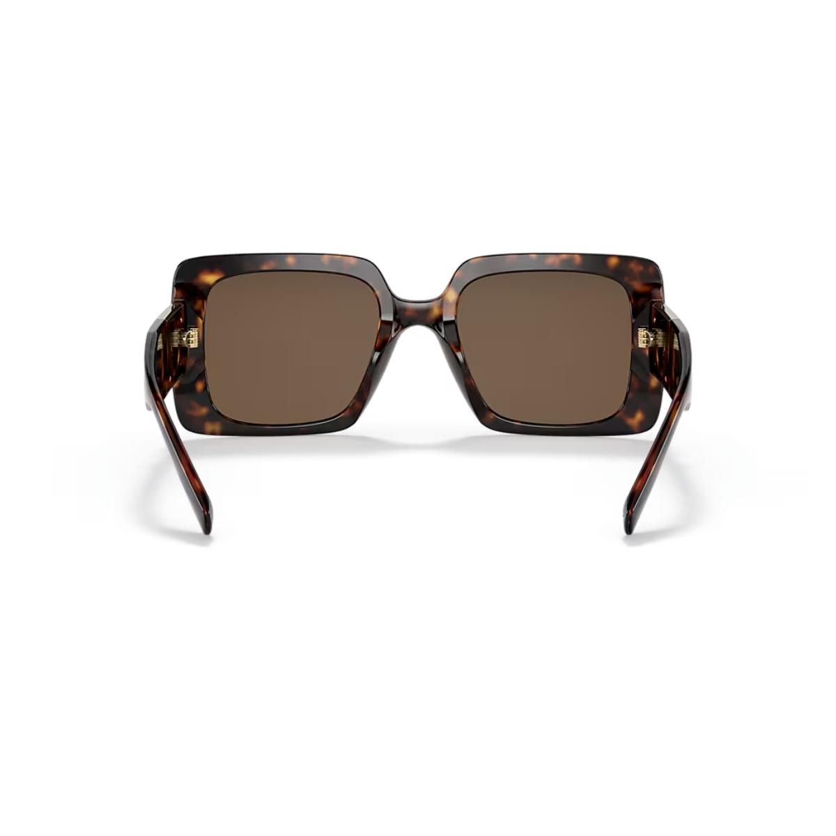 Sunglasses with tortoiseshell frame and brown lenses on a white background