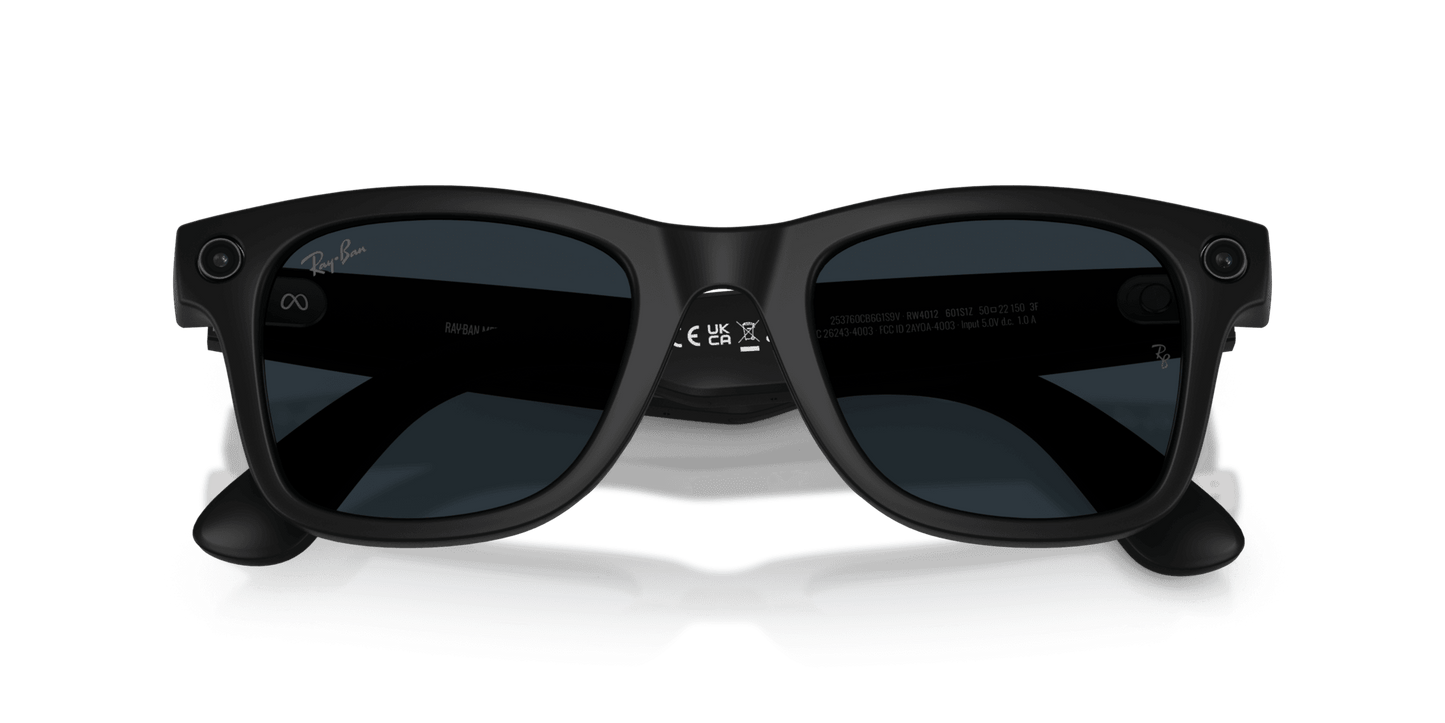 Black sunglasses on a gray stand with a blue gradient background