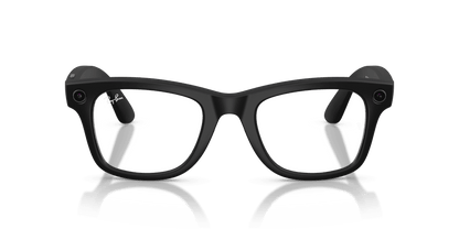 Black glasses on a reflective surface with a dark green background