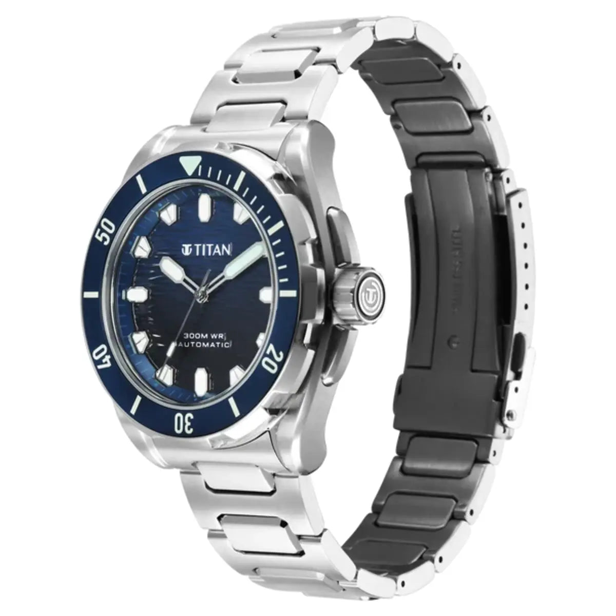 Titan automatic watch with a silver stainless steel link bracelet, a blue dial, and a blue bezel with white markings, shown on a white background.